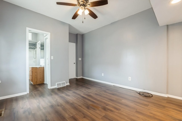 600 SE 2nd St, Grimes, IA 50111 - unfurnished bedroom featuring baseboards, dark wood-style floors, and ceiling fan