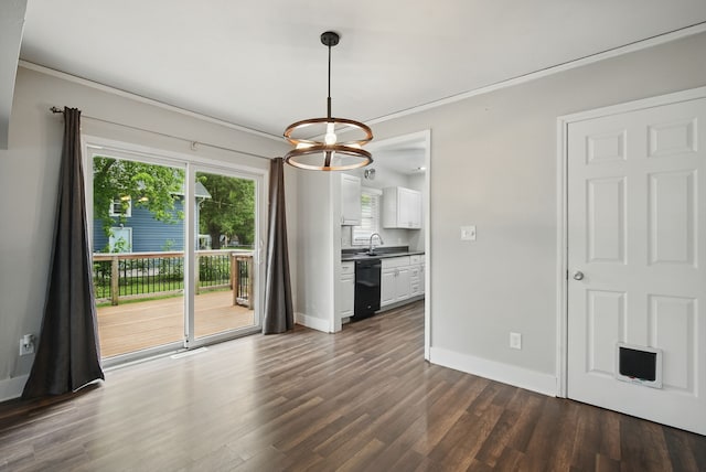 806 8th St, West Des Moines, IA 50265 - unfurnished dining area featuring a chandelier, dark wood finished floors, and crown molding