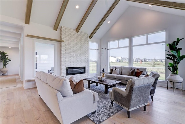 3736 NW 183rd St, Clive, IA 50325 - living room with high vaulted ceiling, beam ceiling, light wood-style floors, recessed lighting, and a brick fireplace