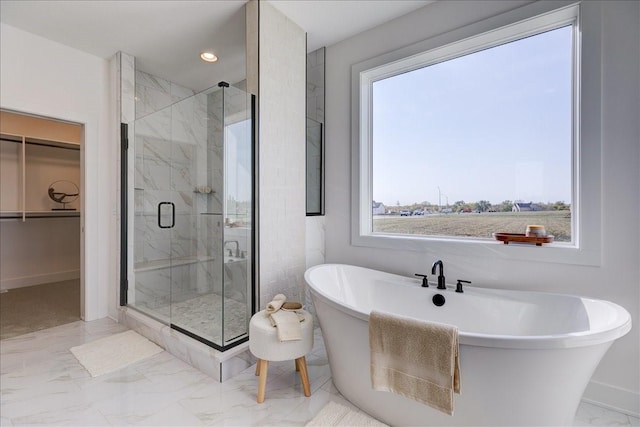 3736 NW 183rd St, Clive, IA 50325 - full bathroom featuring marble look tiles, healthy amount of natural light, a spacious closet, a marble finish shower, and recessed lighting