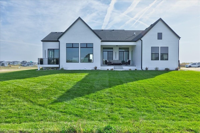 3736 NW 183rd St, Clive, IA 50325 - rear view of property with a ceiling fan, a lawn, a patio area, and roof with shingles
