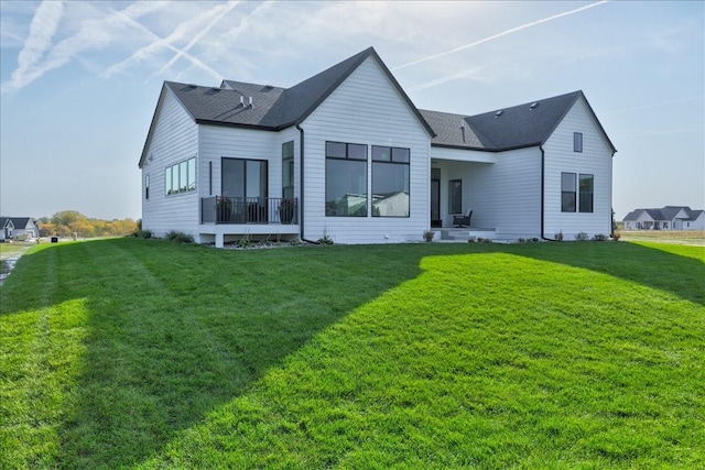 3736 NW 183rd St, Clive, IA 50325 - rear view of property featuring a yard and a shingled roof