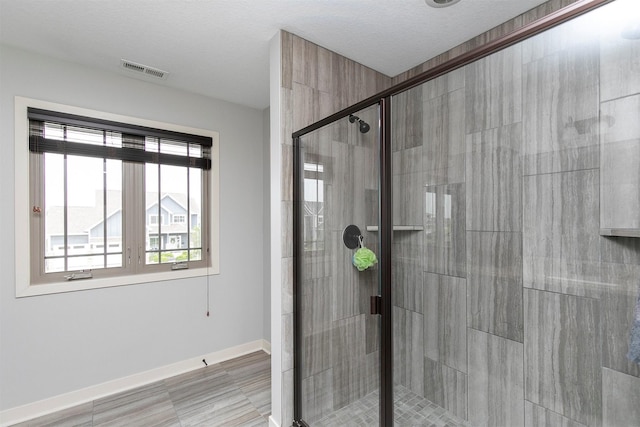 460 NE Bowman Dr, Waukee, IA 50263 - bathroom featuring a shower stall and baseboards