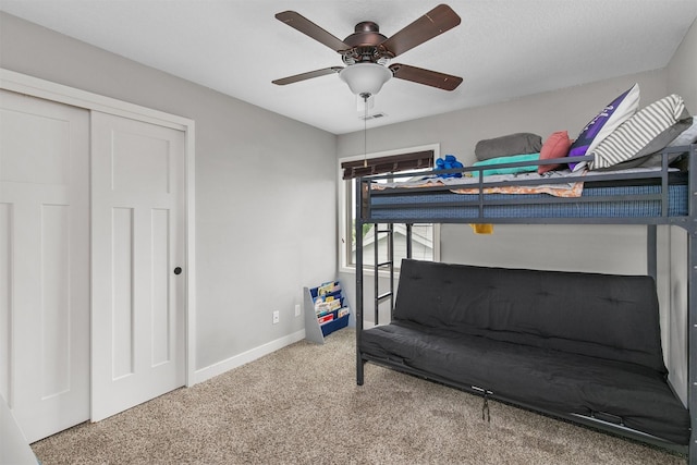 460 NE Bowman Dr, Waukee, IA 50263 - bedroom with carpet, baseboards, ceiling fan, and a closet