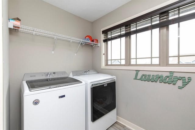 460 NE Bowman Dr, Waukee, IA 50263 - washroom with washer and dryer, baseboards, and light wood finished floors