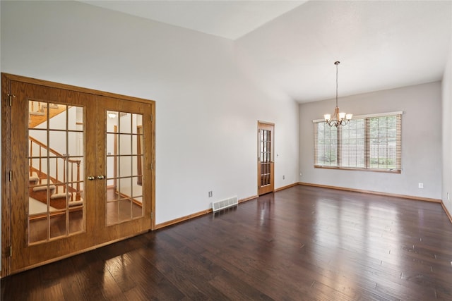 313 29th St, West Des Moines, IA 50265 - spare room with vaulted ceiling, a chandelier, wood finished floors, baseboards, and french doors