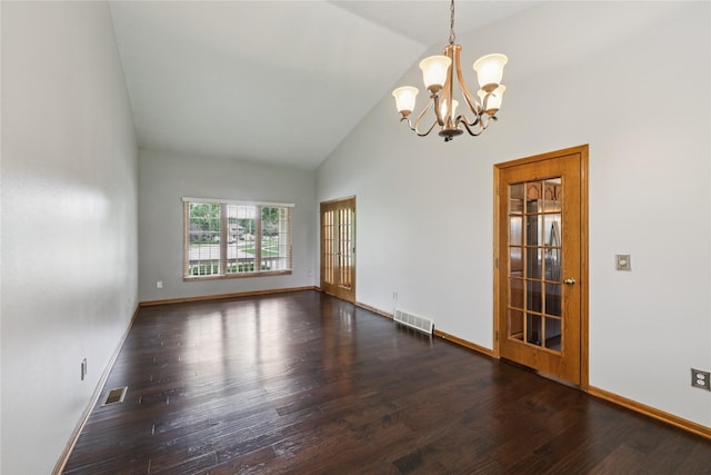 313 29th St, West Des Moines, IA 50265 - empty room with a chandelier, wood finished floors, baseboards, and high vaulted ceiling