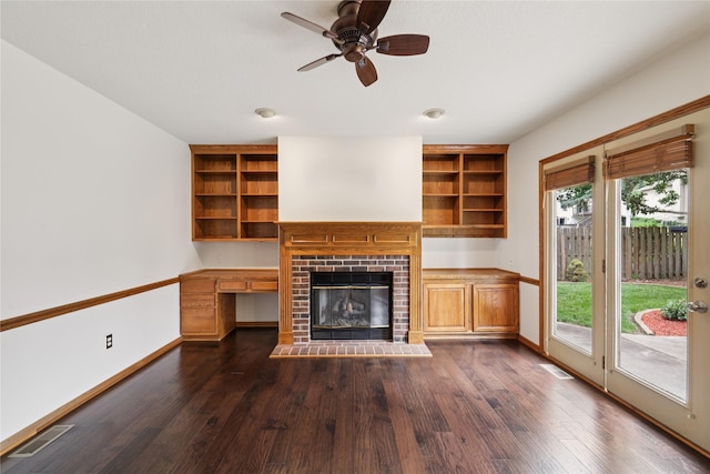 313 29th St, West Des Moines, IA 50265 - unfurnished living room with dark wood finished floors, healthy amount of natural light, a brick fireplace, and ceiling fan