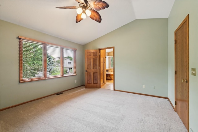 313 29th St, West Des Moines, IA 50265 - unfurnished bedroom featuring vaulted ceiling, light carpet, baseboards, connected bathroom, and ceiling fan