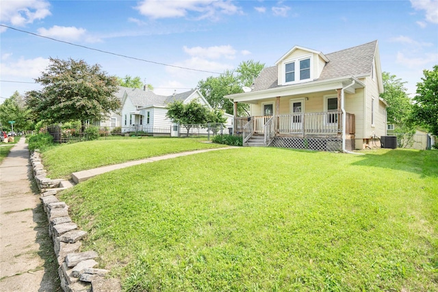 1127 10th St, Des Moines, IA 50314 - bungalow-style home with covered porch, cooling unit, and a shingled roof