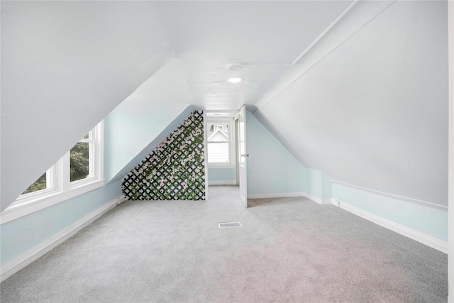 1127 10th St, Des Moines, IA 50314 - bonus room with carpet, vaulted ceiling, and baseboards