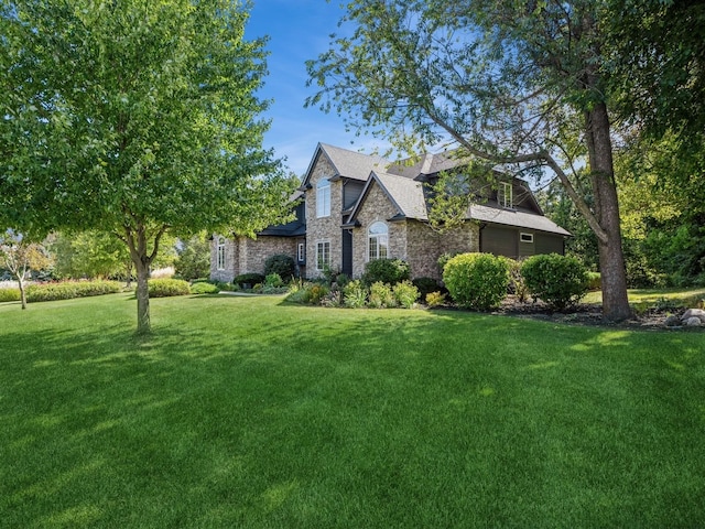 11576 NW Timberbrooke Ln, Grimes, IA 50111 - view of front of home featuring stone siding and a front lawn