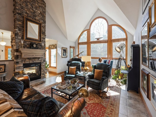 11576 NW Timberbrooke Ln, Grimes, IA 50111 - living area with vaulted ceiling, a stone fireplace, and baseboards