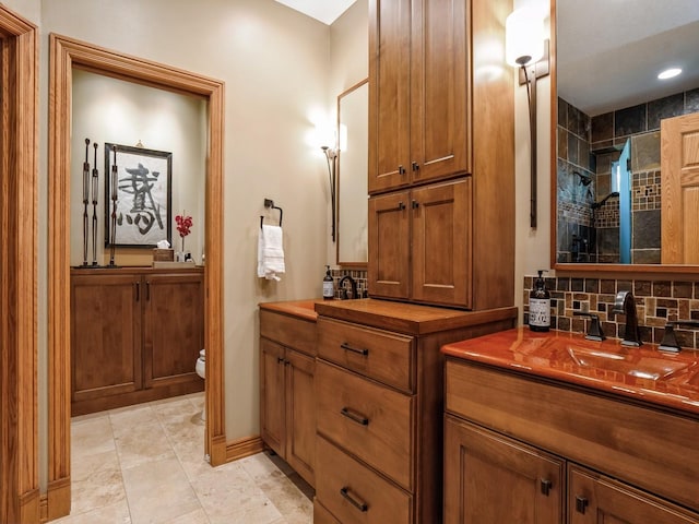 11576 NW Timberbrooke Ln, Grimes, IA 50111 - full bath with toilet, vanity, tiled shower, and tasteful backsplash