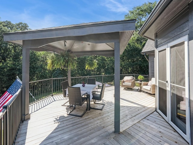 11576 NW Timberbrooke Ln, Grimes, IA 50111 - wooden terrace with outdoor dining space and an outdoor living space