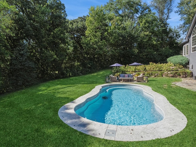 11576 NW Timberbrooke Ln, Grimes, IA 50111 - outdoor pool with outdoor lounge area, a lawn, and a patio