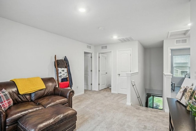 5400 Brook Landing Cir, Des Moines, IA 50317 - living area featuring an upstairs landing, carpet flooring, attic access, baseboards, and recessed lighting