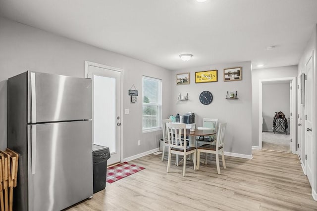 5400 Brook Landing Cir, Des Moines, IA 50317 - dining area with light wood finished floors and baseboards
