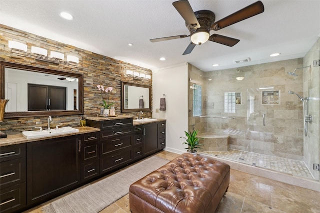 14091 Willow Dr, Clive, IA 50325 - full bathroom with double vanity, a stall shower, a ceiling fan, decorative backsplash, and recessed lighting