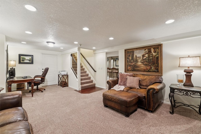 14091 Willow Dr, Clive, IA 50325 - carpeted living area featuring a textured ceiling, recessed lighting, a desk, stairway, and baseboards