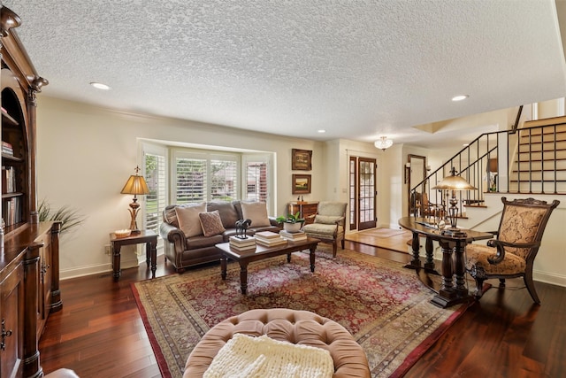 14091 Willow Dr, Clive, IA 50325 - living room featuring a textured ceiling, dark wood-type flooring, stairway, baseboards, and recessed lighting