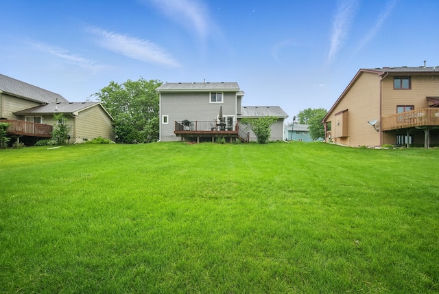 1290 S 4th St, Carlisle, IA 50047 - back of property with a wooden deck and a yard