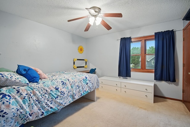 1290 S 4th St, Carlisle, IA 50047 - bedroom featuring carpet, a ceiling fan, a textured ceiling, and baseboards