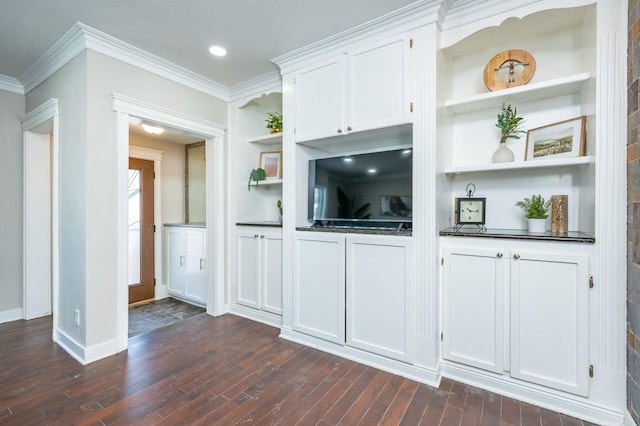 4005 Beaver Ave, Des Moines, IA 50310 - unfurnished living room with dark wood-type flooring, crown molding, built in shelves, baseboards, and recessed lighting