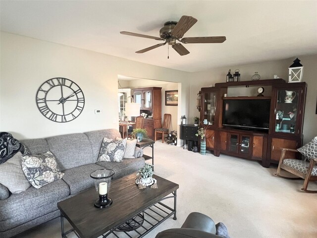 313 E 29th St S, Newton, IA 50208 - living area with carpet flooring and a ceiling fan
