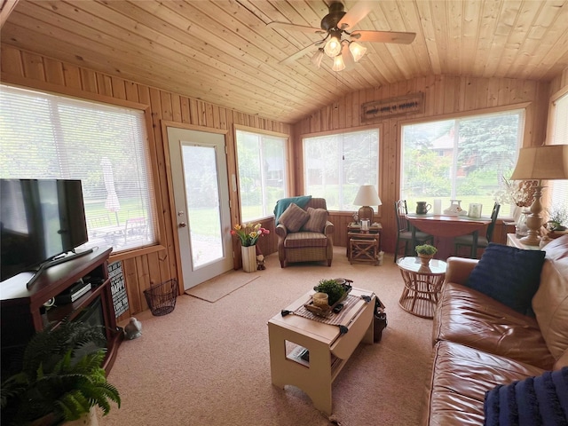 313 E 29th St S, Newton, IA 50208 - carpeted living room featuring lofted ceiling, wood walls, plenty of natural light, a ceiling fan, and wood ceiling