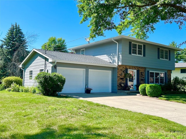 313 E 29th St S, Newton, IA 50208 - view of front facade with an attached garage, a front lawn, driveway, and brick siding