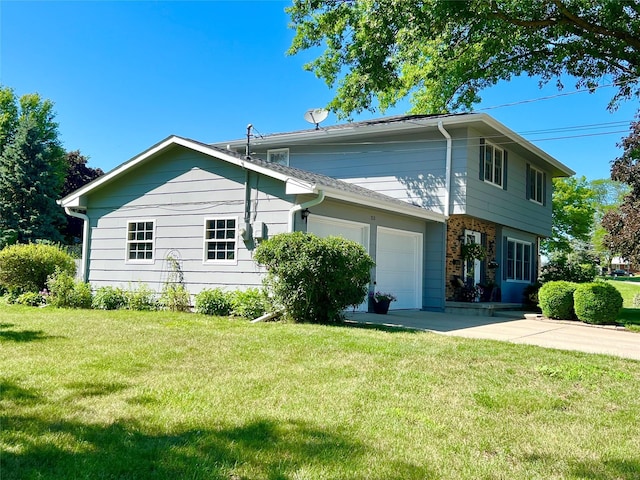 313 E 29th St S, Newton, IA 50208 - view of property exterior with a garage, a lawn, and concrete driveway