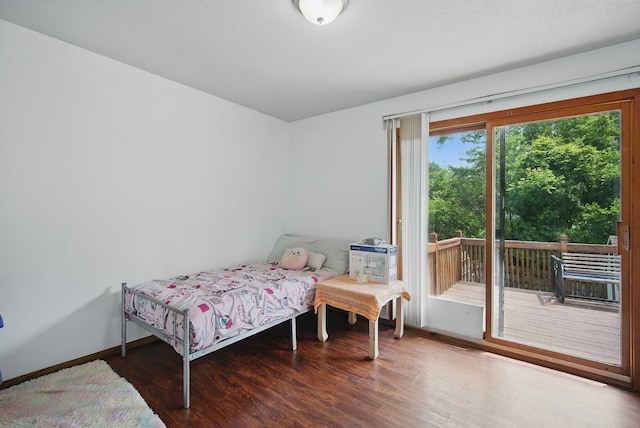 4413 SE 7th St, Des Moines, IA 50315 - bedroom with access to outside, wood finished floors, and baseboards