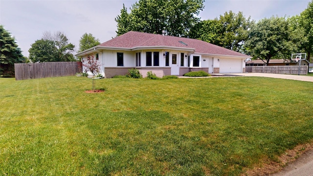 416 S Park St, Stuart, IA 50250 - single story home featuring concrete driveway, an attached garage, and brick siding