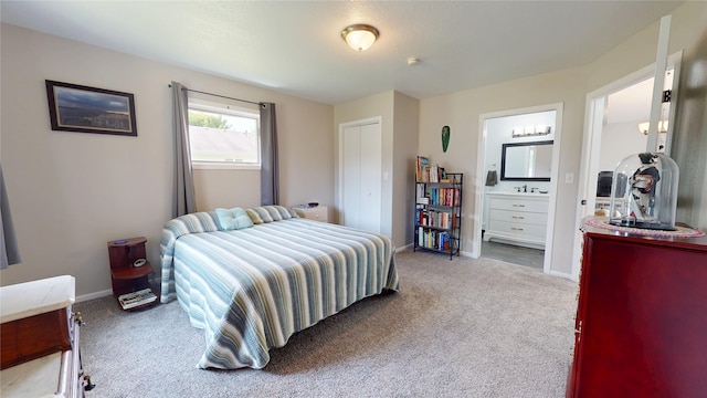 416 S Park St, Stuart, IA 50250 - bedroom featuring light colored carpet, baseboards, and connected bathroom