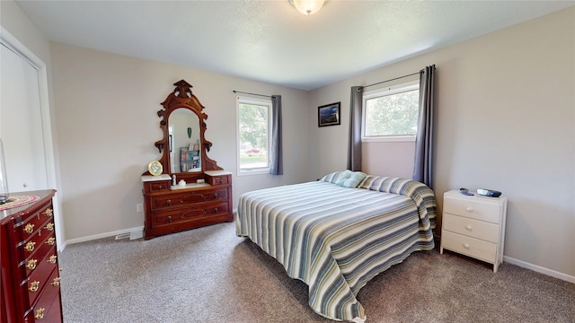 416 S Park St, Stuart, IA 50250 - carpeted bedroom featuring baseboards