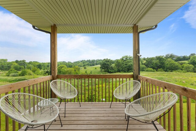 110 Bailey Cir, Waukee, IA 50263 - wooden deck featuring view of wooded area