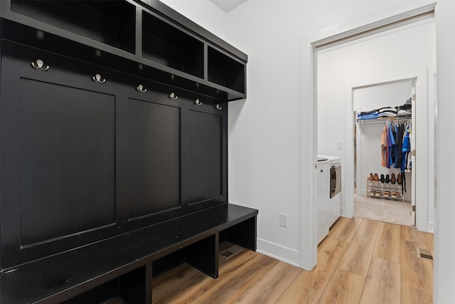 110 Bailey Cir, Waukee, IA 50263 - mudroom featuring washer and clothes dryer, light wood finished floors, and baseboards
