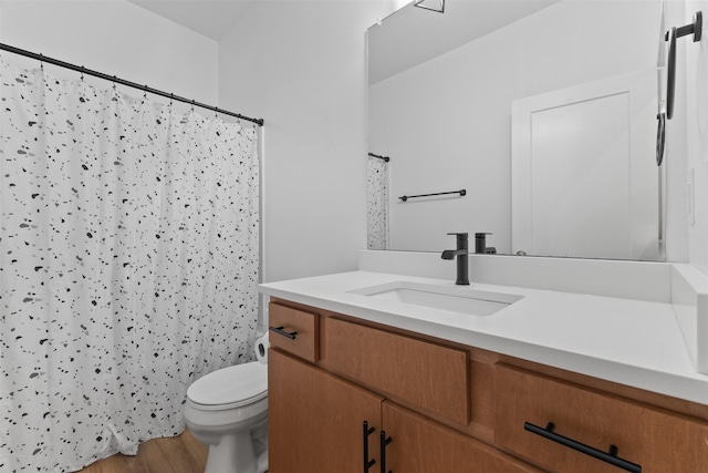 110 Bailey Cir, Waukee, IA 50263 - full bath featuring vanity, toilet, wood finished floors, and a shower with shower curtain