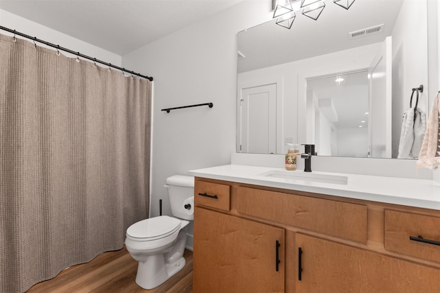 110 Bailey Cir, Waukee, IA 50263 - full bath featuring toilet, wood finished floors, vanity, and a shower with curtain