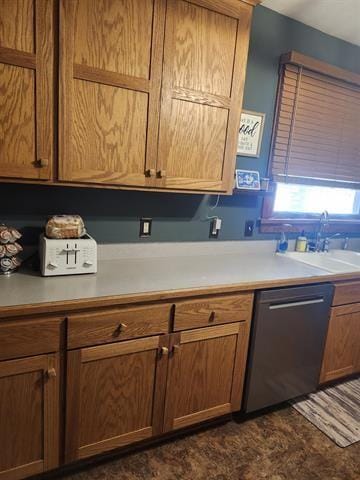 230 Grant St, Murray, IA 50174 - kitchen with stainless steel dishwasher, light countertops, and brown cabinetry