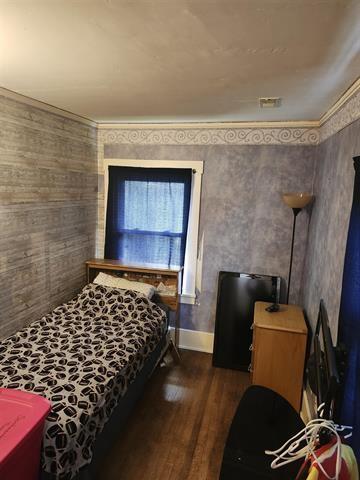 230 Grant St, Murray, IA 50174 - bedroom featuring dark wood-style flooring