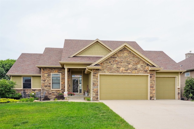 4014 NE Bellagio Cir, Ankeny, IA 50021 - craftsman-style home with stone siding, a front lawn, driveway, a garage, and roof with shingles