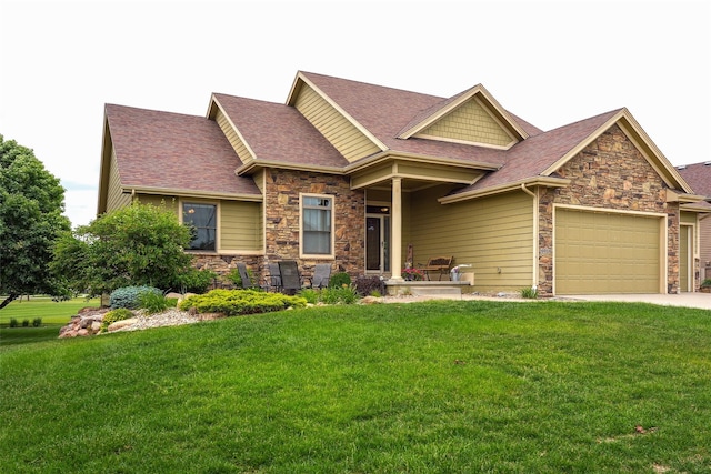 4014 NE Bellagio Cir, Ankeny, IA 50021 - craftsman-style home with stone siding, a front yard, and roof with shingles