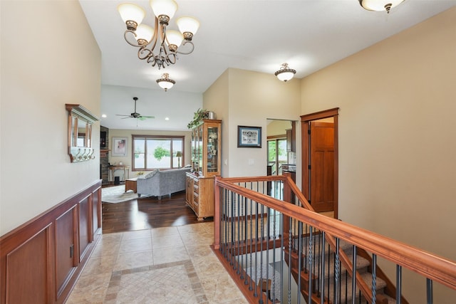 4014 NE Bellagio Cir, Ankeny, IA 50021 - corridor with a chandelier, an upstairs landing, and wainscoting