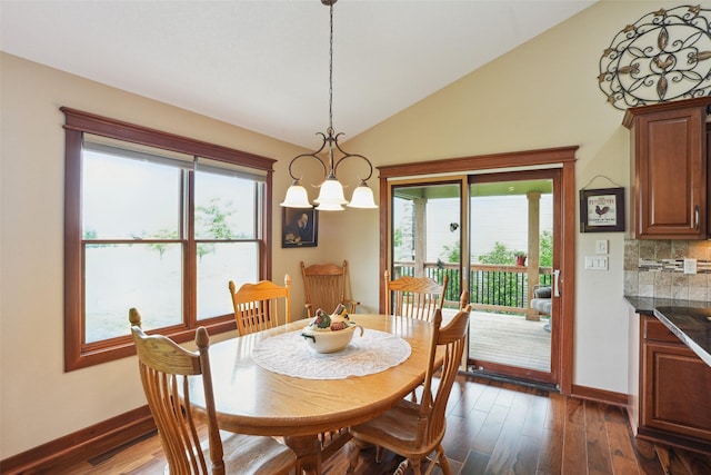 4014 NE Bellagio Cir, Ankeny, IA 50021 - dining area with baseboards, vaulted ceiling, dark wood-style floors, and healthy amount of natural light