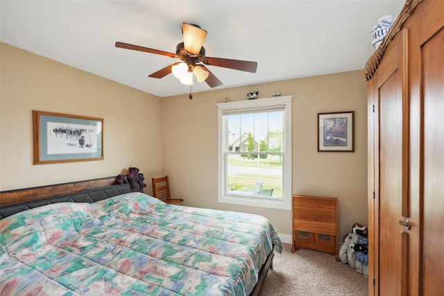 4014 NE Bellagio Cir, Ankeny, IA 50021 - bedroom featuring light colored carpet, ceiling fan, and baseboards