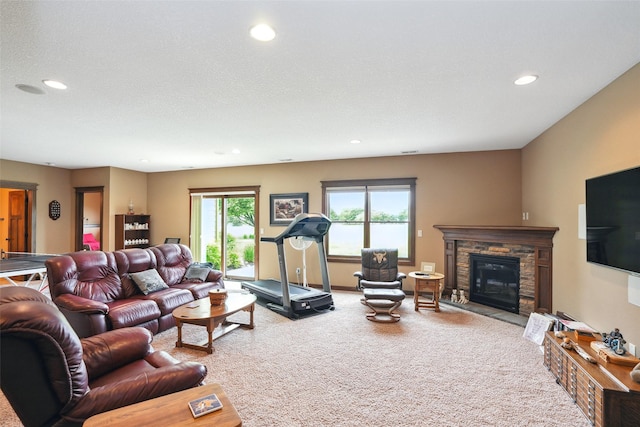 4014 NE Bellagio Cir, Ankeny, IA 50021 - carpeted living room featuring recessed lighting and a stone fireplace