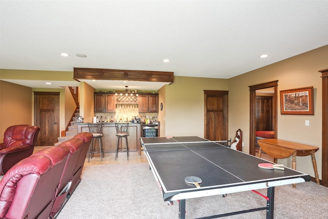 4014 NE Bellagio Cir, Ankeny, IA 50021 - game room featuring bar with sink, recessed lighting, and light colored carpet