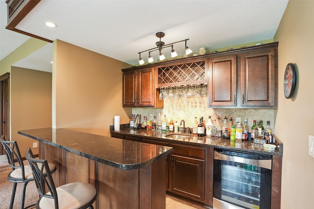 4014 NE Bellagio Cir, Ankeny, IA 50021 - indoor bar with wine cooler, backsplash, track lighting, and recessed lighting